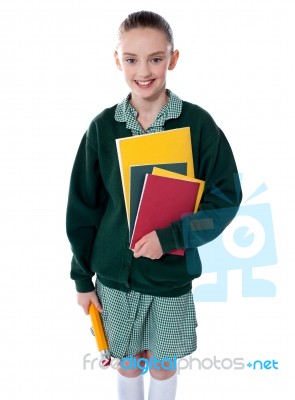 School Girl Standing With Notebooks Stock Photo