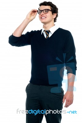 Schoolboy Adjusting His Eyeglasses Stock Photo