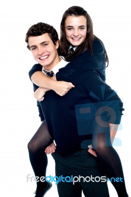 Schoolboy Carrying Piggyback Ride Stock Photo