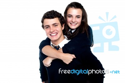 Schoolboy Carrying Piggyback Ride Stock Photo