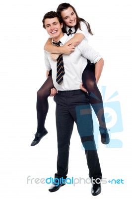 Schoolboy Carrying Piggyback Ride Stock Photo