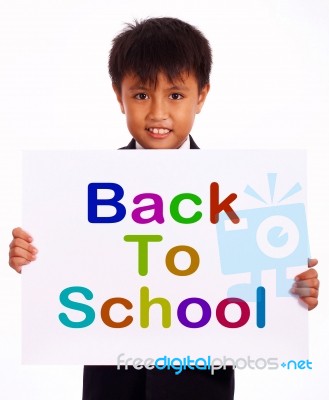 Schoolboy With Back To School Board Stock Photo