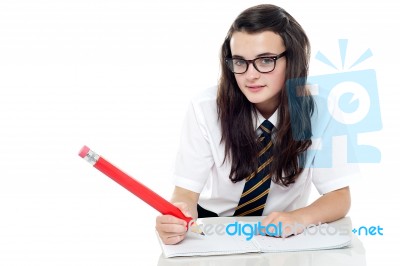 Schoolgirl Holding Pencil Stock Photo