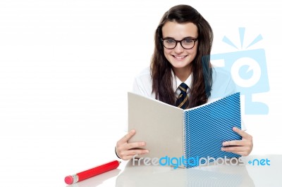 Schoolgirl Reading Books Stock Photo