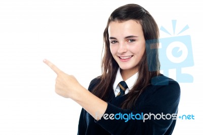 Schoolgirl Showing Pointing Upwards Stock Photo