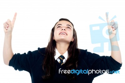 Schoolgirl Showing Pointing Upwards Stock Photo