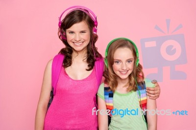 Schoolgirls With Earphone Stock Photo