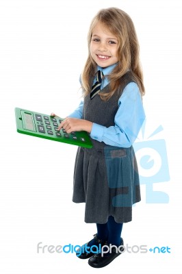 Schoolkid Pressing Key 5 On Big Green Calculator Stock Photo