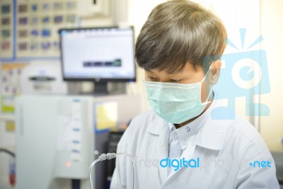 Scientist With Equipment And Science Experiments In White Tone Stock Photo