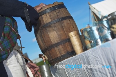 Scottish Man Pouring Rum From Cask Stock Photo