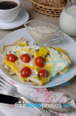 Scrambled Eggs With Tomatoes Stock Photo