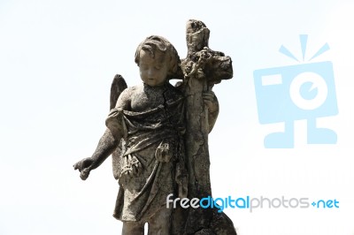 Sculpture Of Little Angel In The Christian Cemetery Stock Photo