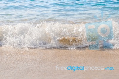 Sea Wave Splashing On The Beach Stock Photo