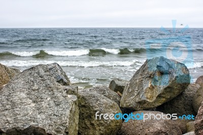 Sea Waves Break Down On A Large Stone Stock Photo