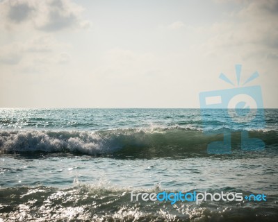 Sea With Surf And Cloudy Sky Stock Photo