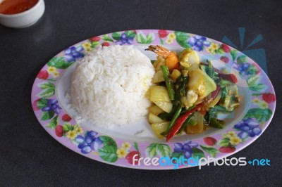 Seafood With Yellow Curry Sauce With Rice , Sauteed Seafood Contains Shrimp Squid, Stock Photo