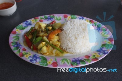 Seafood With Yellow Curry Sauce With Rice , Sauteed Seafood Contains Shrimp Squid, Stock Photo