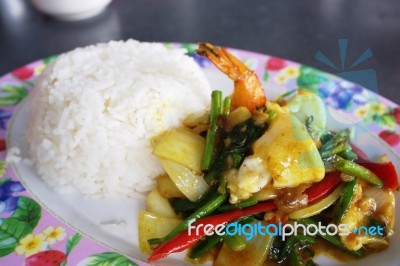 Seafood With Yellow Curry Sauce With Rice , Sauteed Seafood Contains Shrimp Squid, Stock Photo