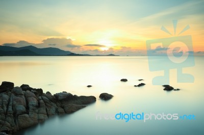 Seascape Sunsset With Fantastic Rock Stock Photo