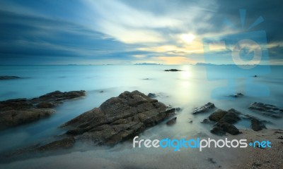 Seascape Sunsset With Fantastic Rock Surface Stock Photo