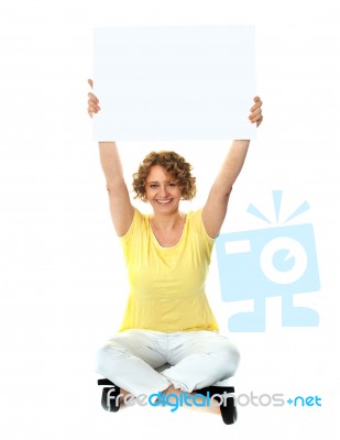 Seated Lady Showing Blank Billboard Stock Photo