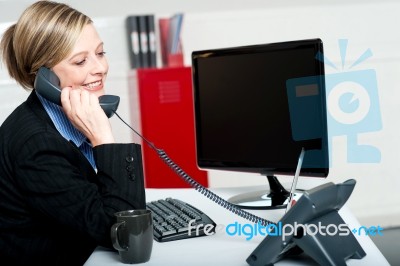 Secretary Answering Bosses Call Stock Photo