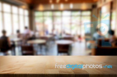 Selected Focus Empty Brown Wooden Table And Coffee Shop Or Resta… Stock Photo