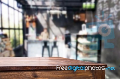 Selected Focus Empty Brown Wooden Table And Coffee Shop Or Resta… Stock Photo