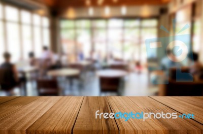 Selected Focus Empty Brown Wooden Table And Coffee Shop Or Resta… Stock Photo