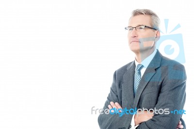 Senior Business Executive With Arms Folded Stock Photo