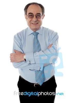 Senior Businessman Arm Crossed Stock Photo