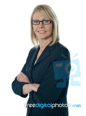 Senior Businesswoman Arms Crossed Stock Photo