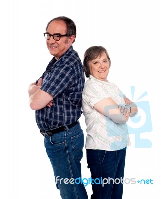 Senior Couple With Arms Crossed Stock Photo