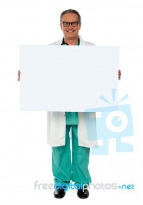 Senior Doctor Holding Blank Board Stock Photo