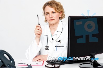 Senior Doctor Holding Pen Stock Photo