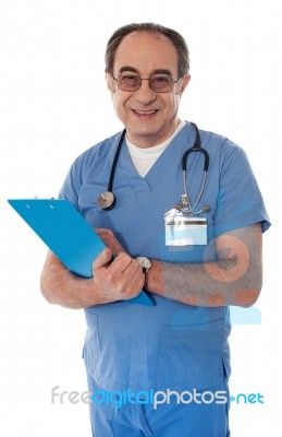 Senior Doctor Holding Reports Stock Photo