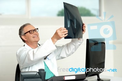 Senior Doctor Holding X Ray Stock Photo