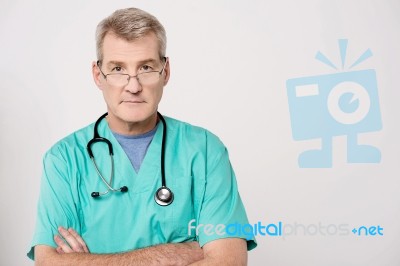 Senior Doctor Looking At Camera Stock Photo