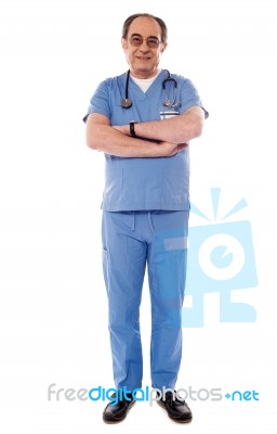 Senior Doctor With Arm Crossed  Stock Photo