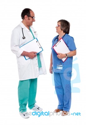 Senior Doctors Discussing Case Stock Photo