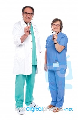 Senior Doctors Holding Stethoscope Stock Photo