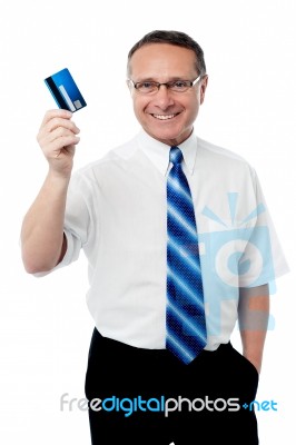 Senior Executive Showing His Credit Card Stock Photo