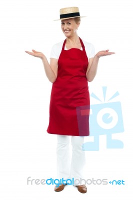 Senior Female Chef Showing Gesture Stock Photo