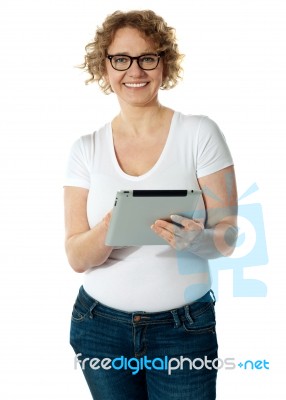 Senior Lady Holding Tablet PC Stock Photo