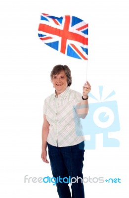 Senior Lady Holding UK Flag Stock Photo