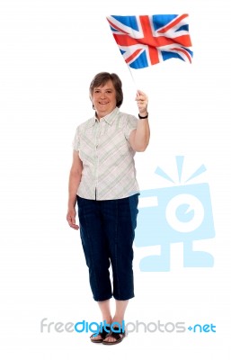 Senior Lady Holding UK Flag Stock Photo