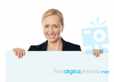 Senior Lady Represting Ad Space Stock Photo