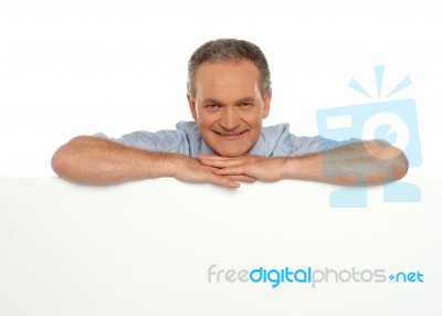 Senior Male Behind Blank Board Stock Photo