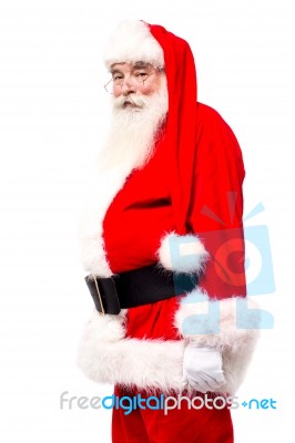 Senior Man In Santa Costume Side Shot Stock Photo