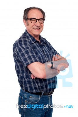 Senior Man Posing With Arm Crossed Stock Photo